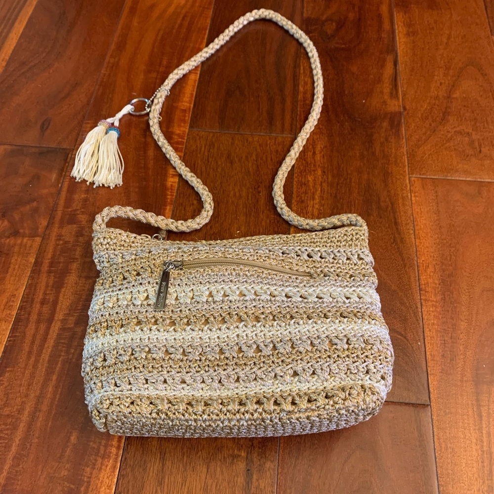 Purse. Multicolor, crocheted purse with shoulder strap and tassel accent.